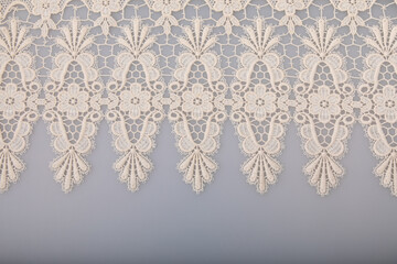 Light blue background with white lace texture
