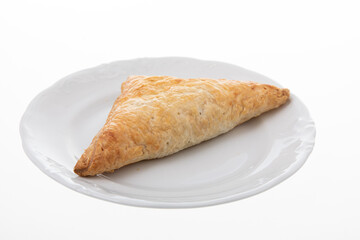 Crispy chicken patty triangle shape on white plate