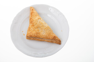 Crispy chicken patty triangle shape on white plate