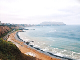 Coastline, beach, hills and the shore seen from Miraflores in Lima, Perú.