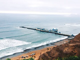 Fotobehang A pier in the ocean of Lima, Perú. © saga