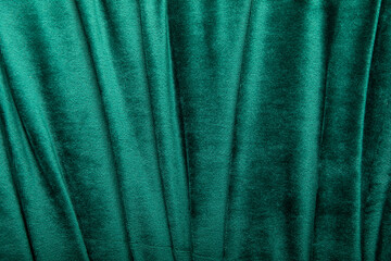 Background green teal velvet textile, suede, velor, chair. Close up photo