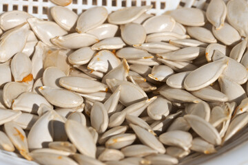 Closeup of a pumpkin seeds in a bowl