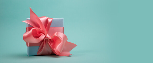 Banner with beautiful Gift box tied with a pink ribbon. Good for Easter Special offers or Spring...