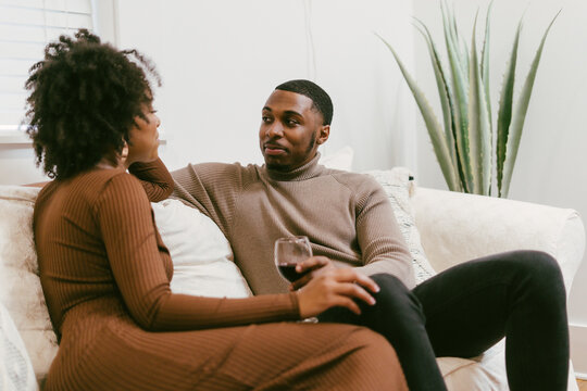 Intimate coversation, black couple at home