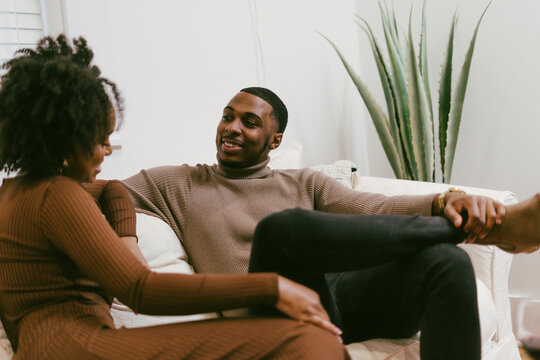 Intimate coversation, black couple at home