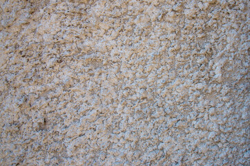 rough plaster facade painted white as a texture or background