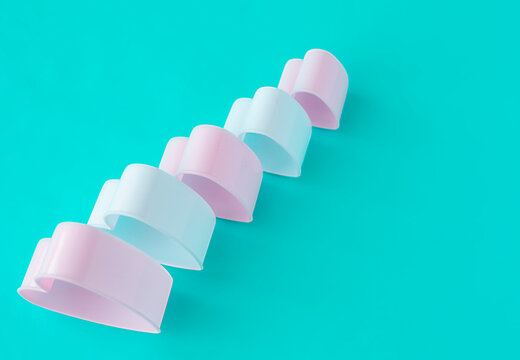 baking dish in the form of hearts on a blue background, concept photo, symbol of love