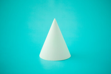Fototapeta premium minimalism, geometric white cone on turquoise background