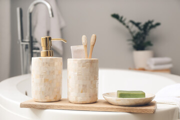 Soap with toothbrushes in bathroom