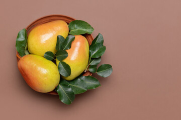 Composition with fresh pears on color background