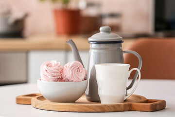 Composition with teapot on kitchen table