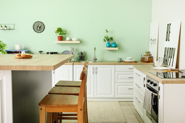 Stylish interior of modern kitchen with dining table