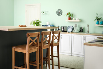 Stylish interior of modern kitchen with dining table