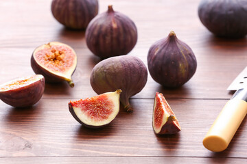 Fresh ripe figs on wooden background