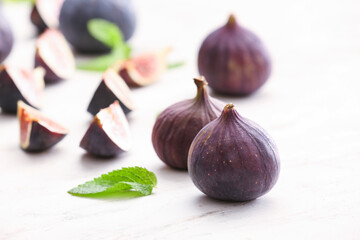 Composition with fresh figs on light background