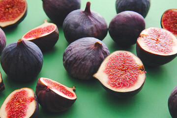 Composition with fresh figs on color background