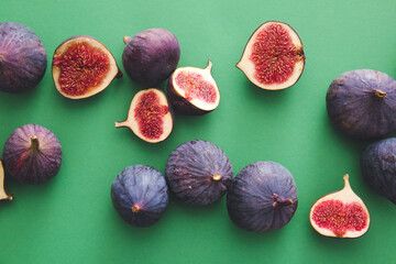 Composition with fresh figs on color background