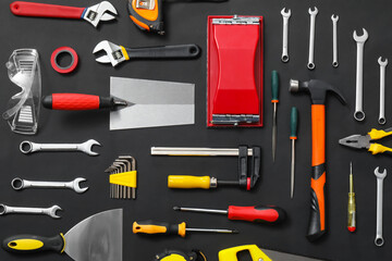 Set of construction tools on dark background