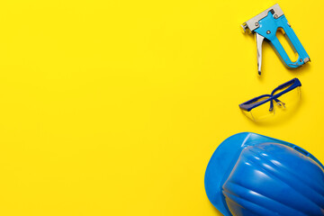 Set of construction tools on color background