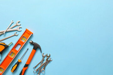 Set of construction tools on color background