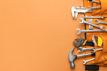 Set of construction tools on color background