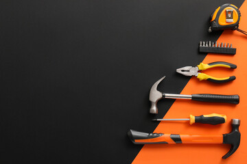 Set of construction tools on colorful background