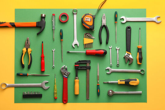 Set of construction tools on colorful background