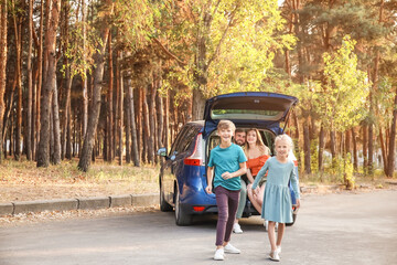 Happy family near car outdoors