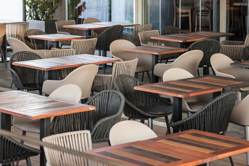 Selective blur on Empty terrace and patio of a bar restaurant of Belgrade, Serbia, closed with shortened working hours due to coronavirus covid 19 lockdown measures to prevent the spread of disease
