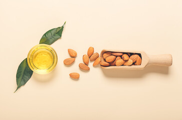 Composition with almond oil on color background