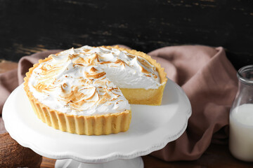 Dessert stand with tasty coconut pie, closeup