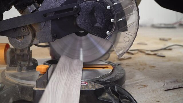 Miter Saw, electric power carpentry tools. cutting batten for laminate floor