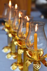 Candles were lit up in the golden candle holders on the table to observe and commemorate Buddha's birth, enlightenment and passing into Parinirvana on Visakha Bucha (Vesak) day at the Thai temple. 