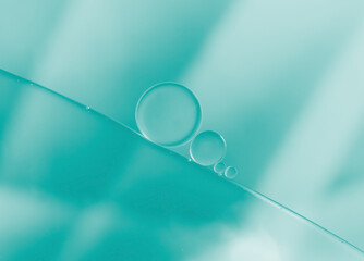 Abstract Oil and water droplets on green  colour background.