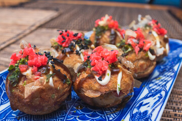delicious octopus ball with wooden background