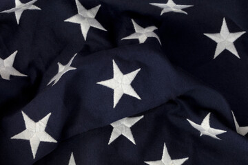 Fototapeta na wymiar Single center star in focus with other stars on blue section of American Flag