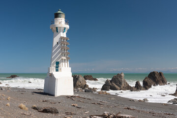The lower Pencarrow Head lighthouse at the entrance to Wellington Harbour, with Cook Strait in the...