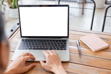 computer screen blank mockup.hand woman work using laptop with white background for advertising,contact business search information on desk at coffee shop.marketing and creative design