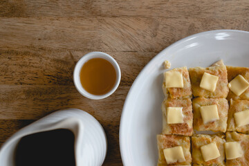 Set of Chinese tea and pancake on a wooden table.