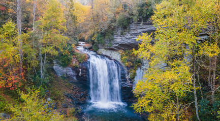 Fototapeta na wymiar Autumn view of Looking Glass Falls in the Pisgah National Forest near brevard