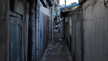 Dark alley or street of old part of Seoul city, south Korea. Undeveloped part of mega city.