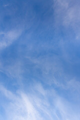 The sky on a sunny day with clouds. vertical direction background.