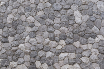 pattern of modern style decorative uneven cracked real gray color stone wall surface with cement