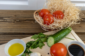 Tomatoes and cucumbers on the table, olive oil and balsamic vinegar, garlic, vegetables, vegetarianism, healthy eating