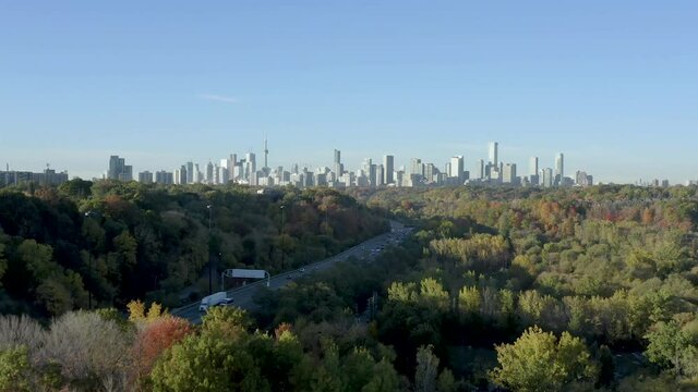 Aerial view of the Toronto skyline as seen from Toronto's Don Valley. Autumn trees in the foreground, the CN Tower in the background