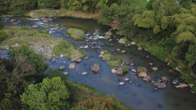 aerial footage of wild nature river in the forest of dominican republic , aque Del Norte River