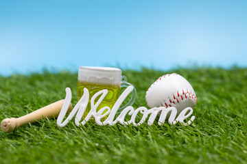 Baseball with Welcome sign for Party on green grass 