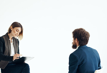 Business man and woman in suit on a light background communication staff job interview