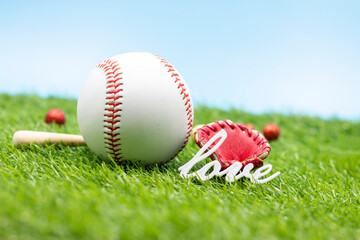 Baseball with love are on green grass